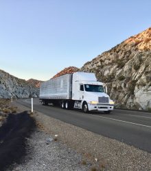 big-rig-on-the-road-through-the-desert-pass-in-cal-2025-03-08-09-08-55-utc-min