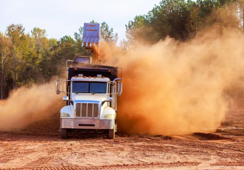 construction-truck-at-work-creating-dust-in-constr-2025-03-27-05-04-46-utc-min