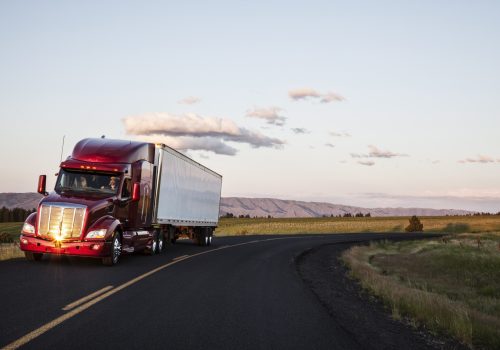 truck-on-a-highway-through-the-grasslands-area-of-2025-04-05-05-02-19-utc-min
