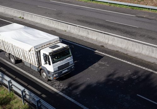 truck-on-road-with-clear-container-2025-02-22-15-44-55-utc-min